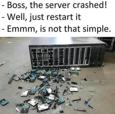 A broken server with parts scattered everywhere and a joke about the boss telling to "just restart it."