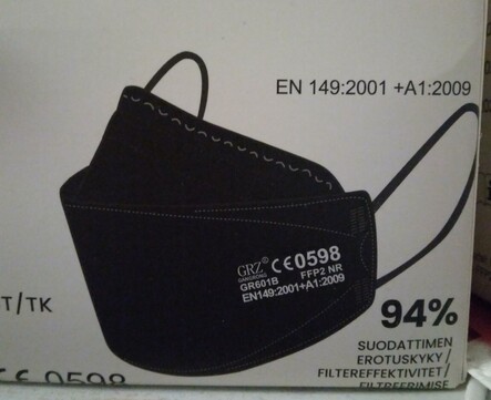 Picture of black FFP2 mask on a box of them.
CE0598, GR6091B, FFP2 NR, EN149:2001+A1:2009 94% filtration.