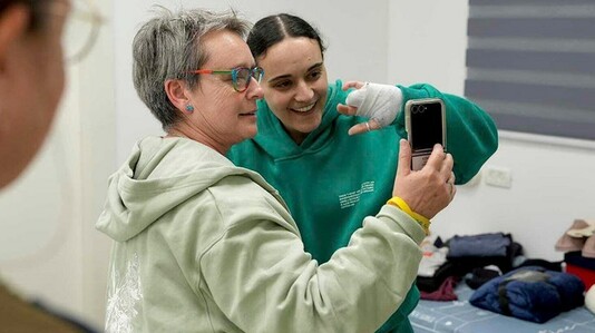 Emily Damari, right, and her mother Mandy are seen near kibbutz Reim, southern Israel after Emily was released from captivity by Hamas terrorists in Gaza, on Sunday, Jan. 19. (AP/Israeli Army)
