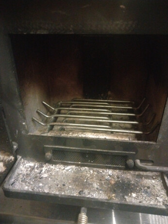 New 2 piece fire grate in its new home, my mini woodstove.